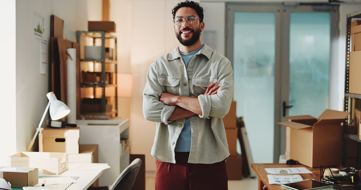 Ecommerce, portrait or man with arms crossed for startup, confident entrepreneur or logistics supplier